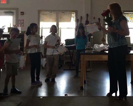 Presentation of Certificates of Excellence, Roses, and Chocolate Cherry Protein Bars